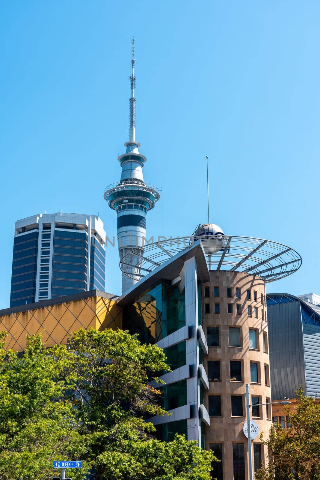 AUCKLAND, NEW ZEALAND - JANUARY 29, 2023 - Old skyscrapers in downtown Auckland and the Skytower in the background, New Zealand