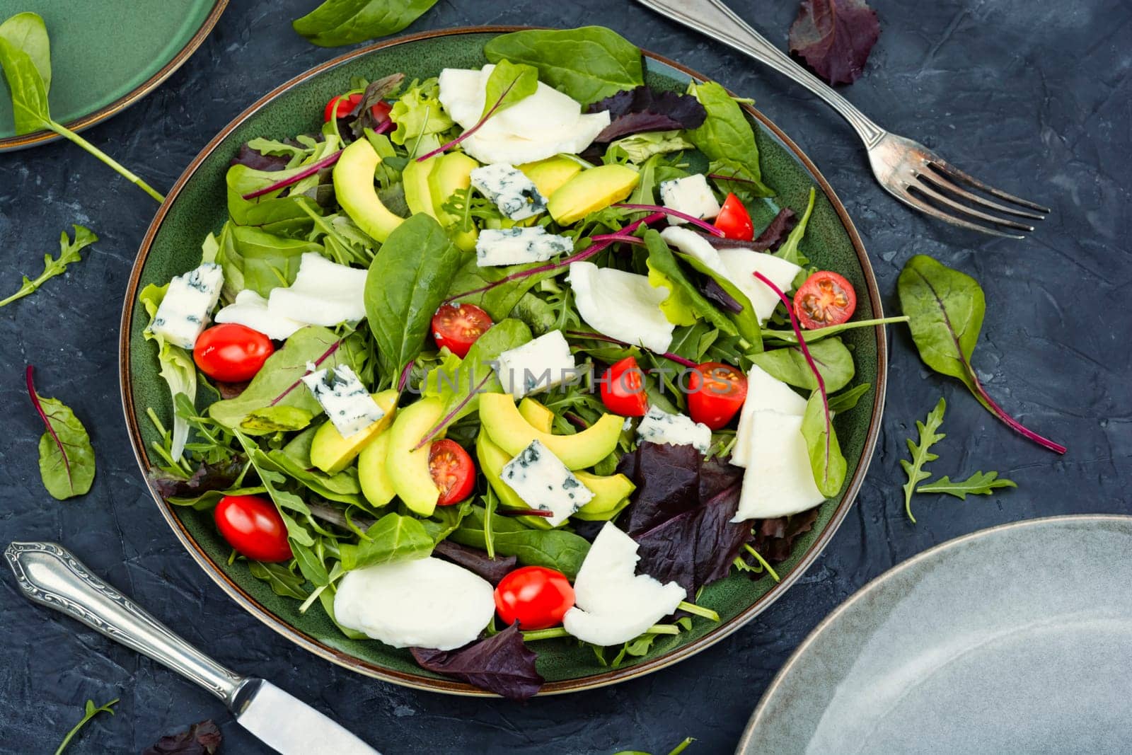 Diet salad of fresh vegetables, herbs and cheese. Healthy food