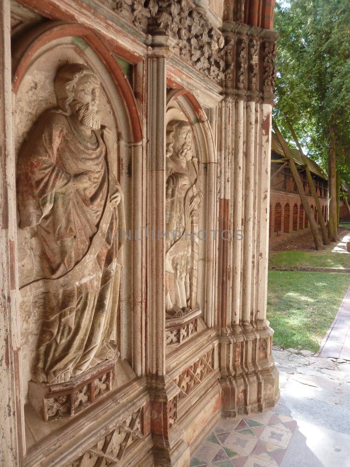 MALBORK, POLAND - SEPTEMBER 03, 2020 - Relief of Saints at the Church of famous gothic Malbork castle in Poland