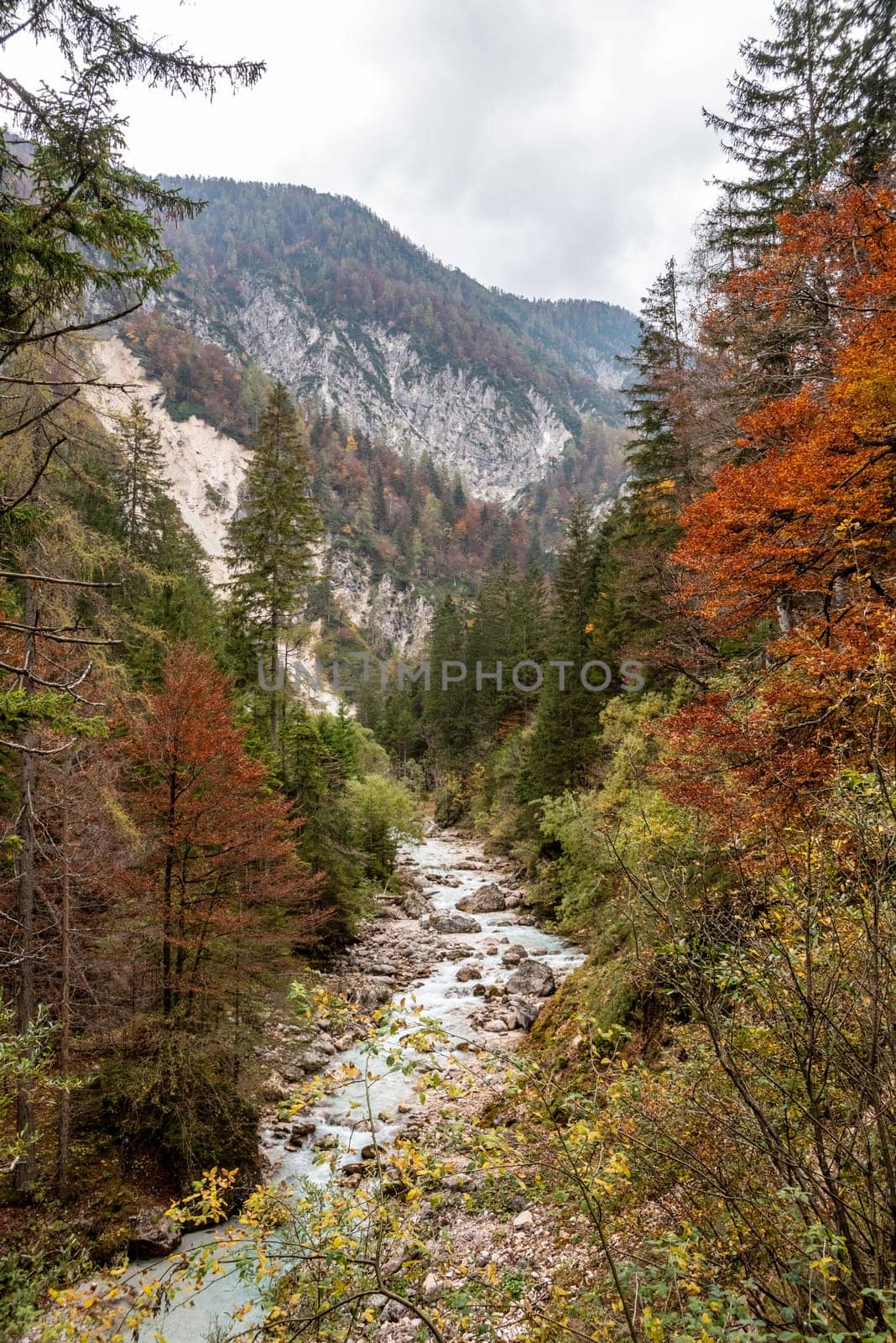 Hiking through the Vrata valley in autumn, Triglav National Park in the Julian Alps, Slovenia