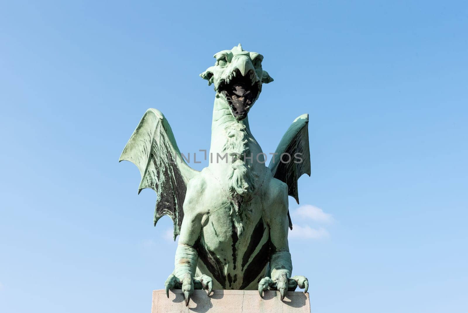 A dragon statue on the Dragon Bridge, symbol of the city of Ljubljana, Slovenia