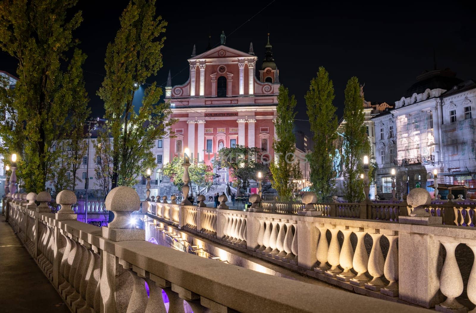 Famous Three Bridges and the Preseren square in the center of Ljubljana illuminated at night, Slovenia
