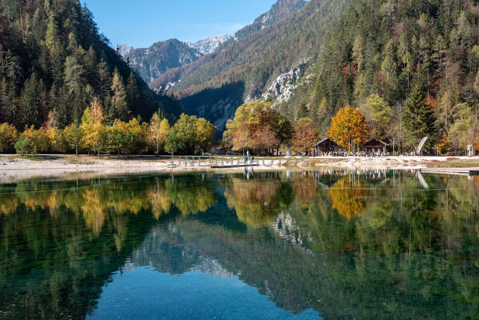 Scenic autumn forest at Crystal Lake in the Julian Alps, Slovenia