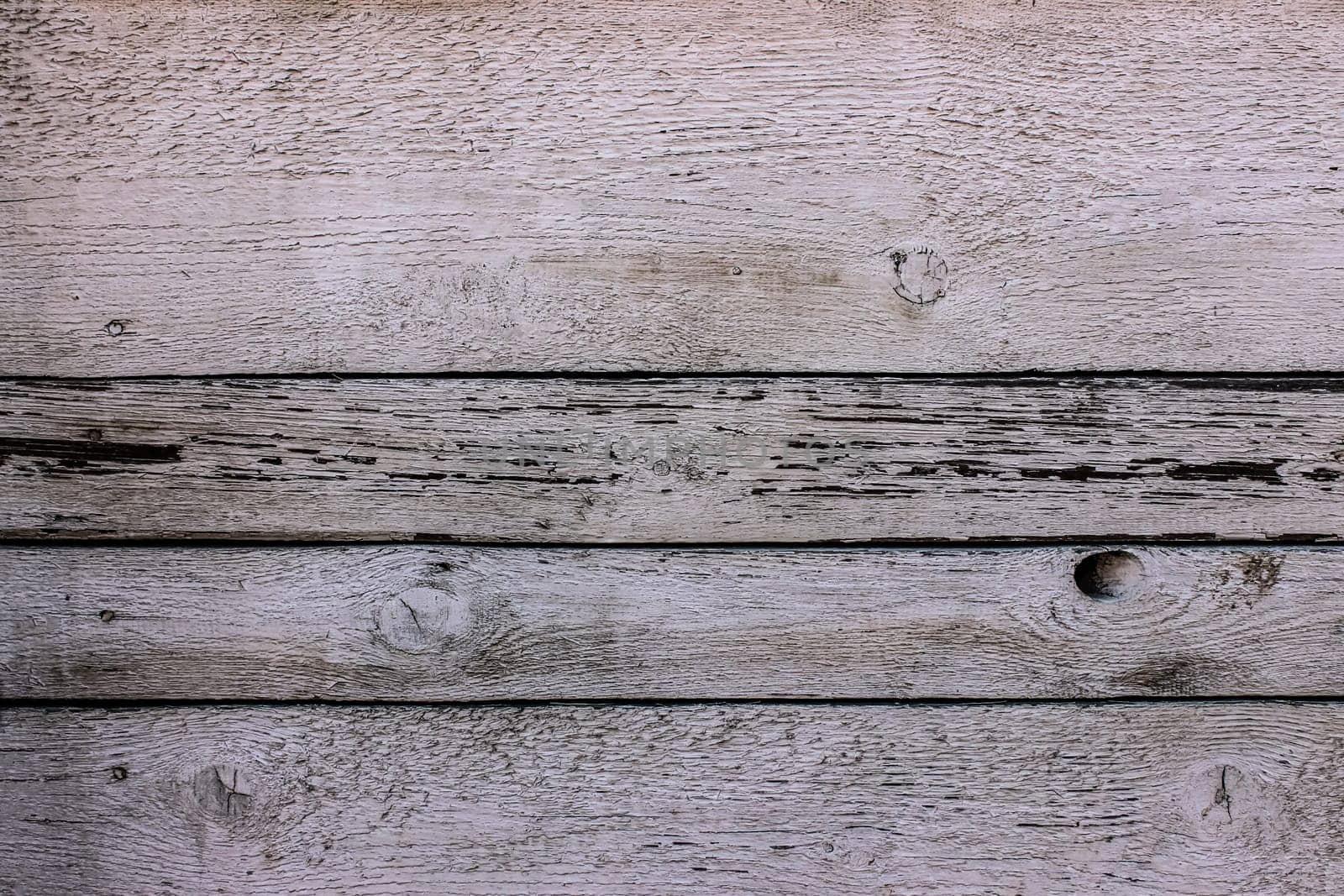 Old white stained-glass windows with traces and defects have gaps and nails.