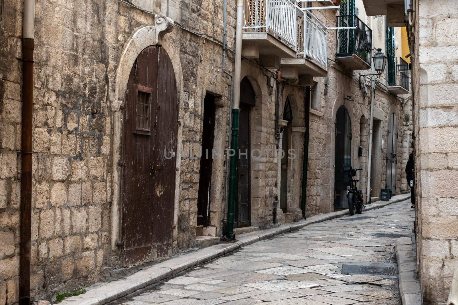 An abandoned narrow and stony alleyway in downtown Bari, Italy