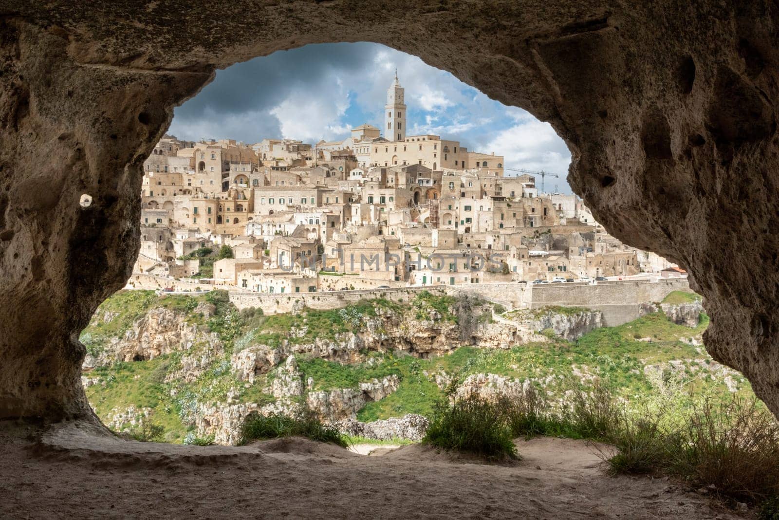 Scenic view of historic downtown with its cathedral, photo taken from a cave house, Italy