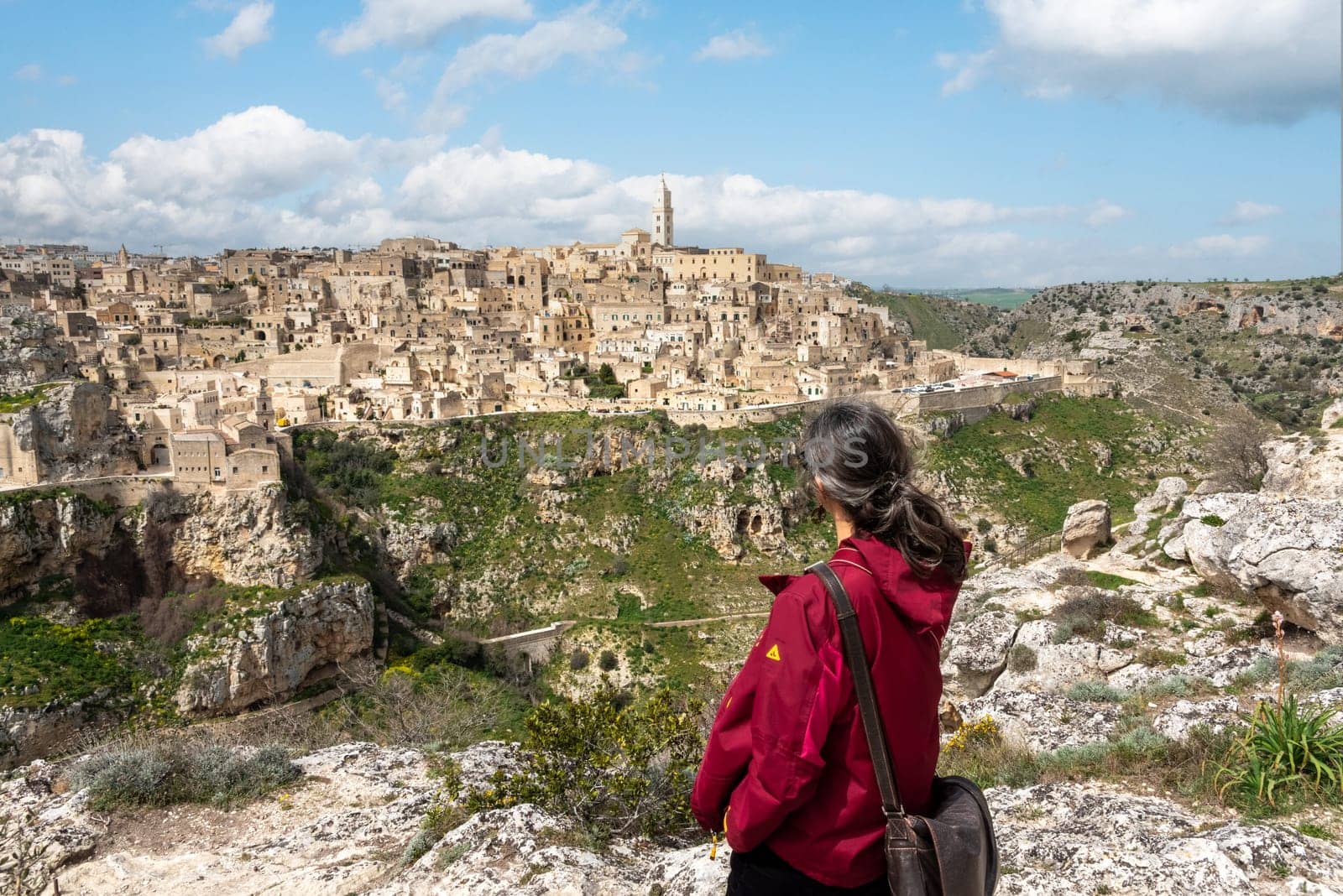 A woman enjoying the view over downtown Matera, Italy