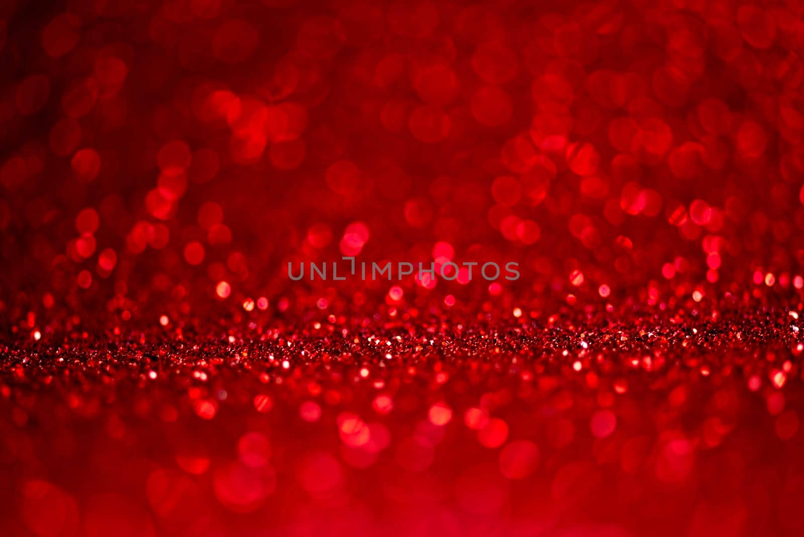 Abstract blur red glitter background card for Valentine's day, christmas and wedding celebration. Love bokeh sparkle confetti textured layout. Modern elegant design.