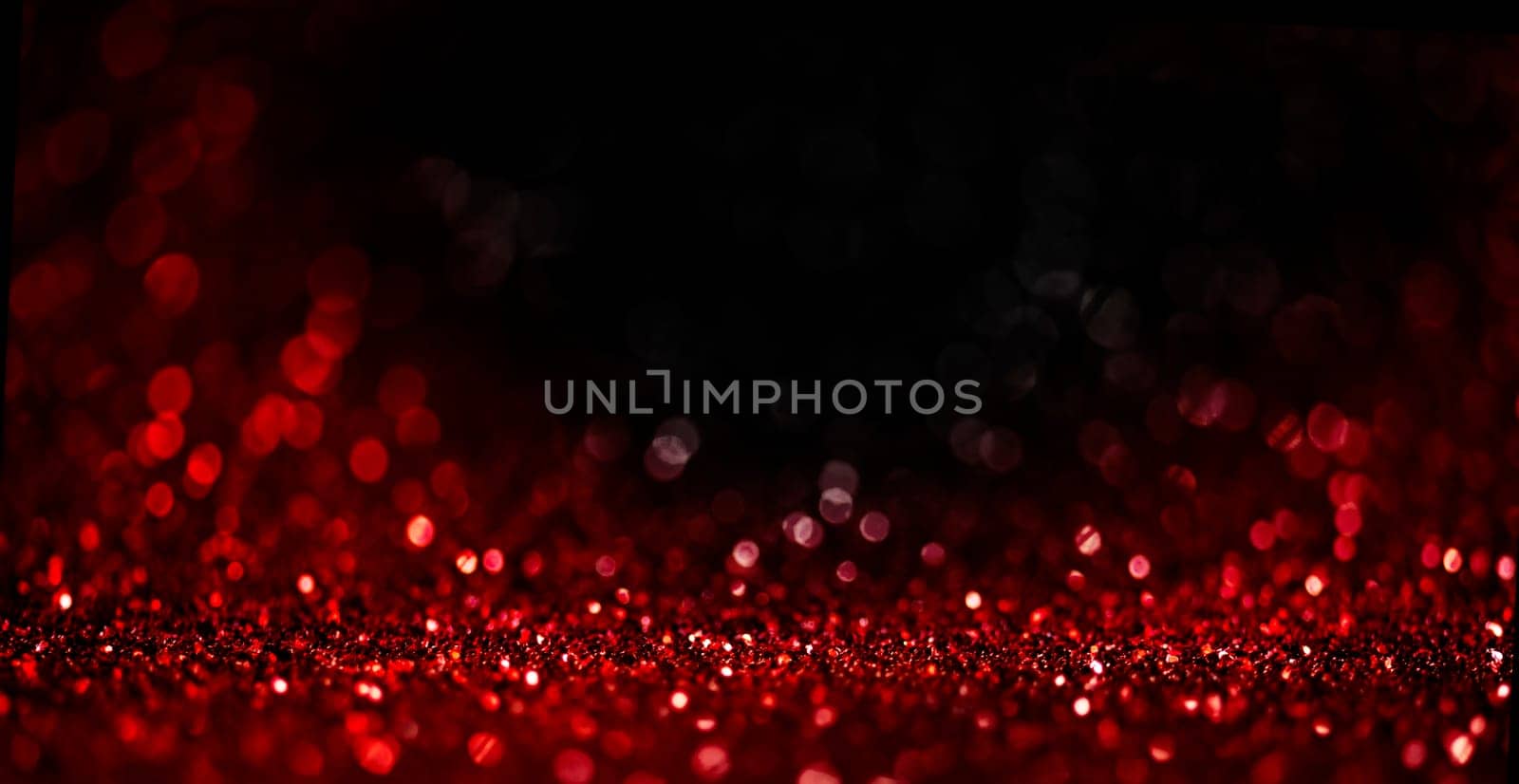Abstract blur red glitter on black background. Card for Valentine's day, christmas and wedding celebration. Love bokeh sparkle confetti textured layout. Classy elegant design.