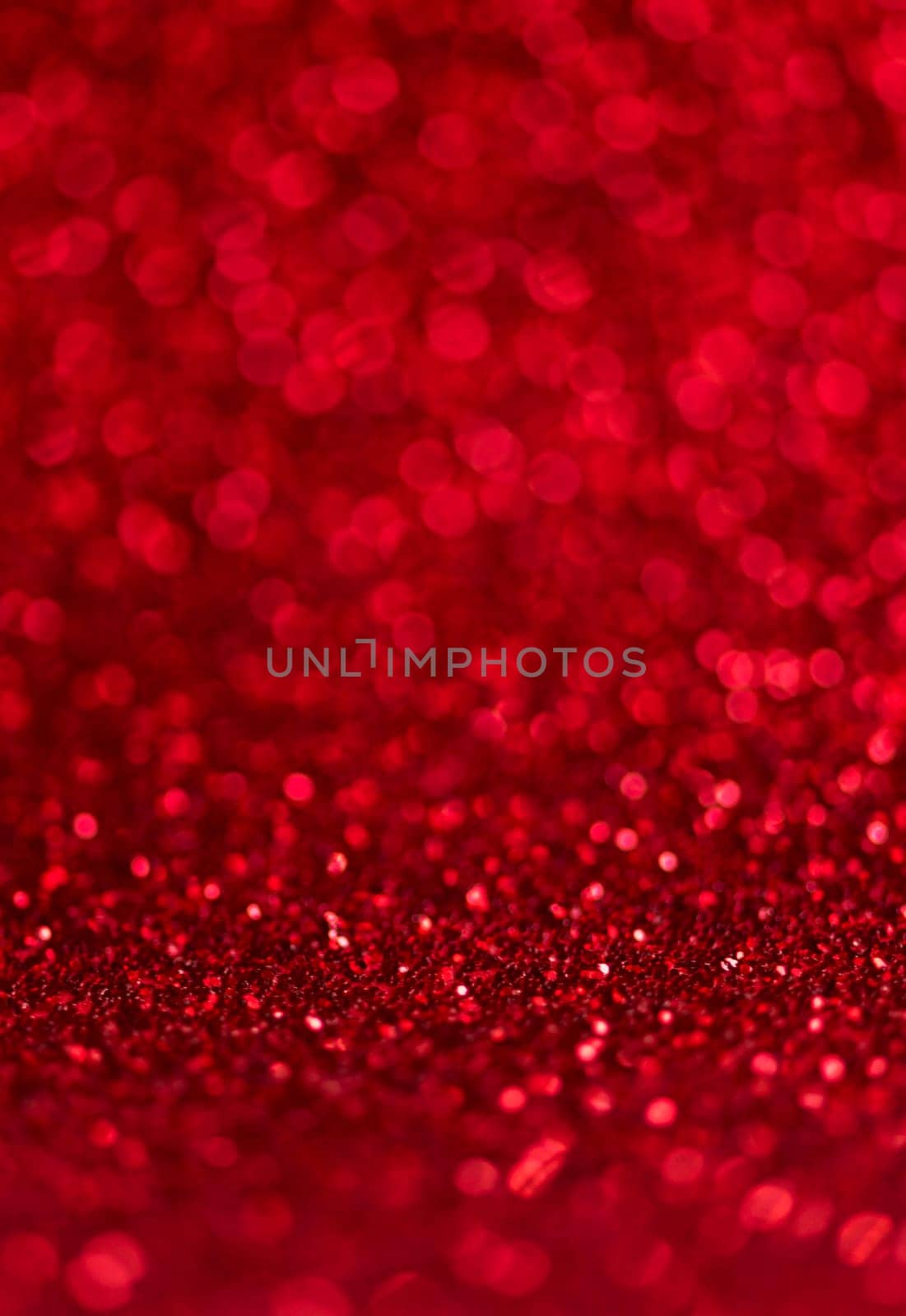 Abstract blur red glitter background card for Valentine's day, christmas and wedding celebration. Love bokeh sparkle confetti textured layout. Modern elegant design.