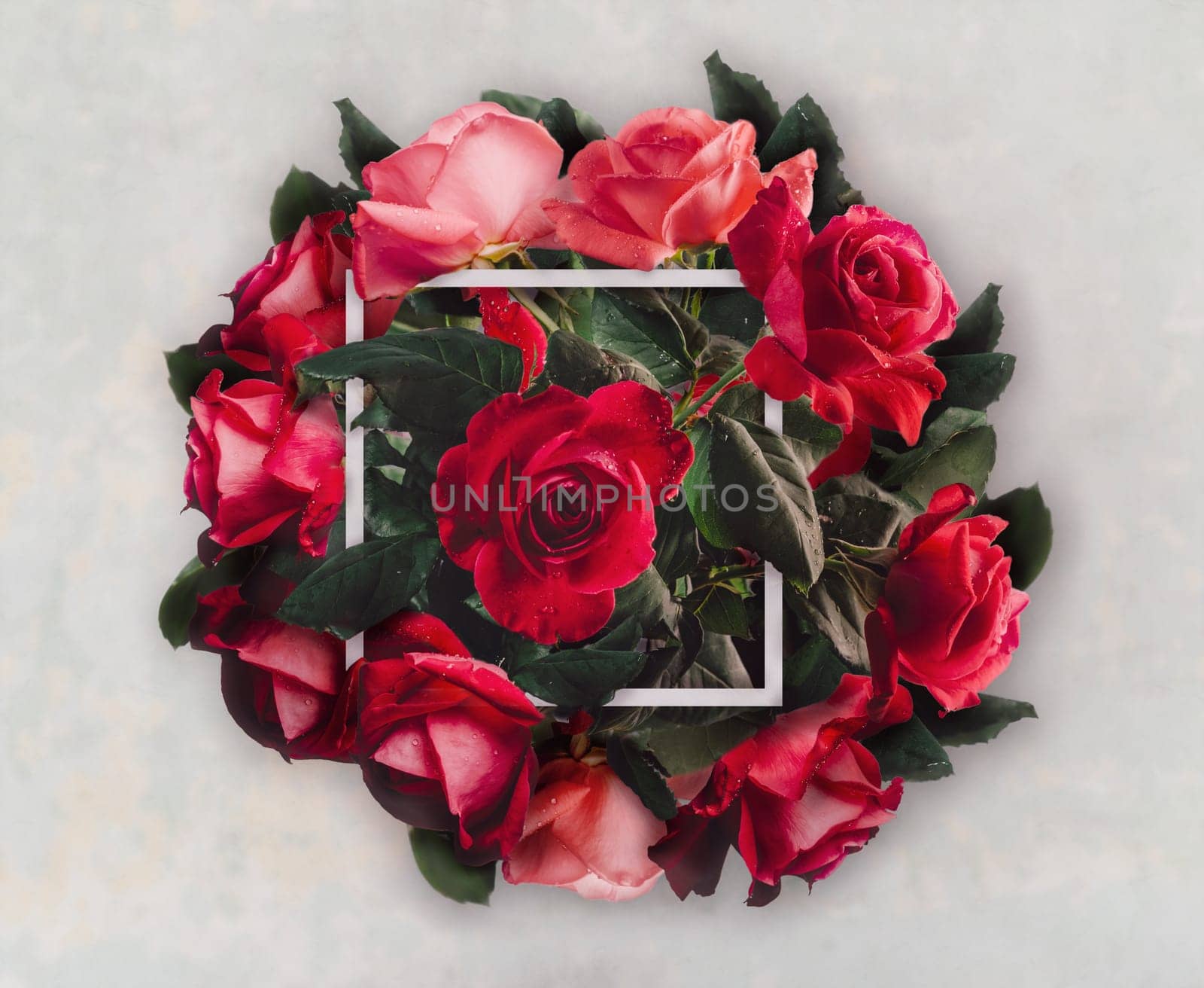 Beautiful red roses bouquet for valentie's day gift. Creative wedding flower decoration. Vintage valentine present with floral bloom and frame. Top view.