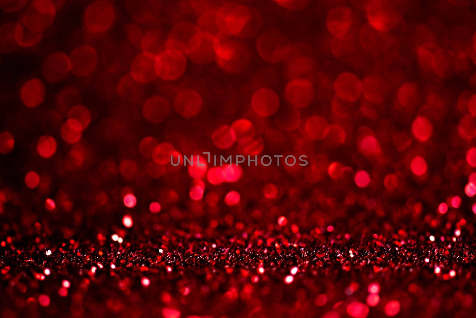 Abstract blur red glitter background card for Valentine's day, christmas and wedding celebration. Love bokeh sparkle confetti textured layout. Modern elegant design.