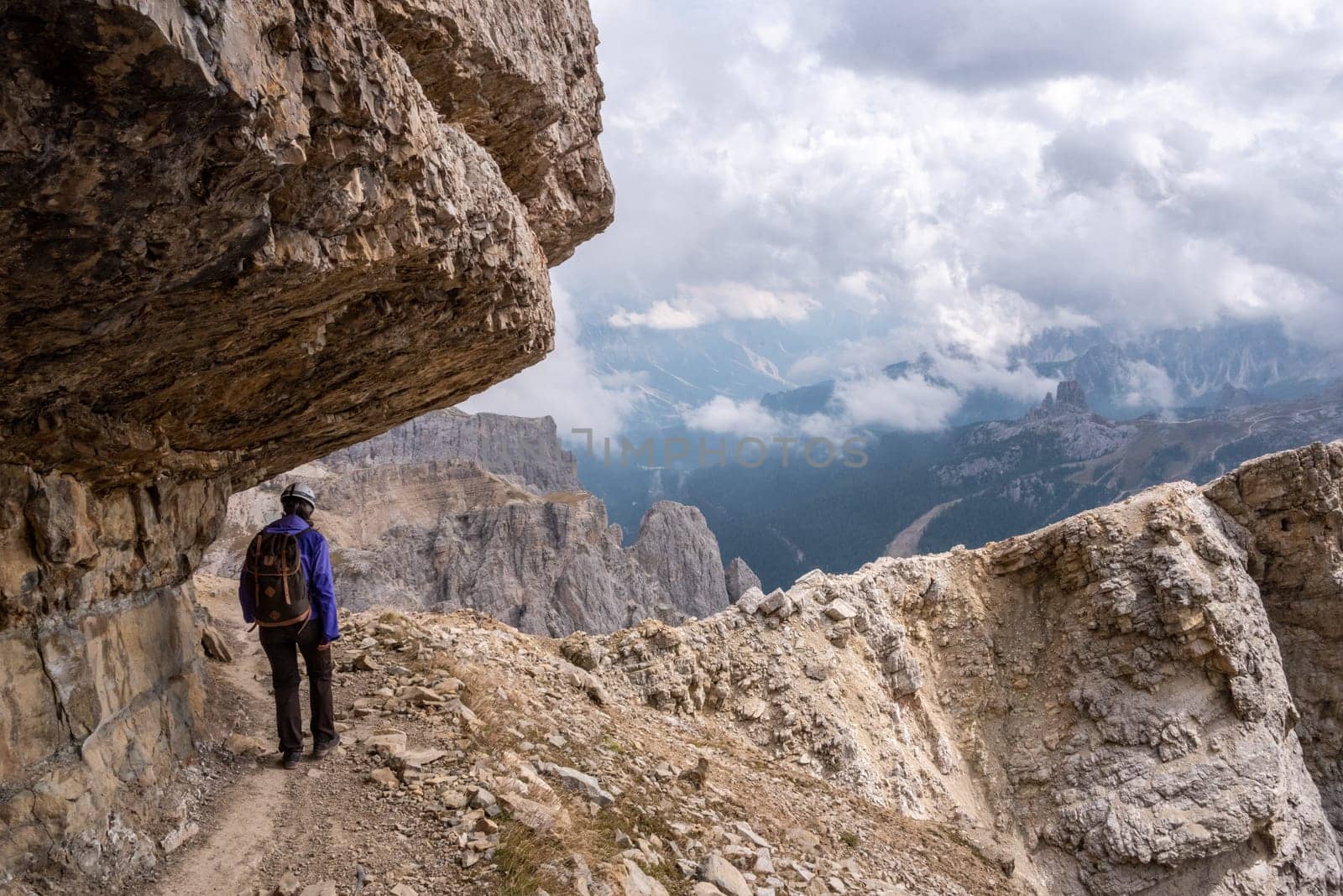 Adventurous hike up to mount Lagazuoi in the Dolomite Alps, view on the Valparola pass, autonomous pronvince of South Tirol in Italy