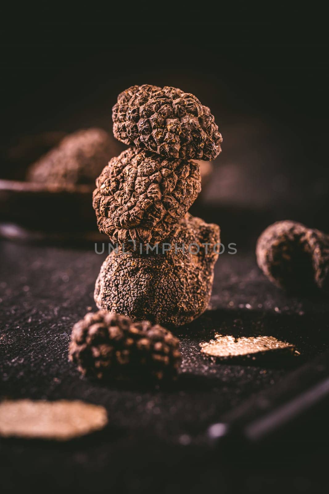 Expensive black truffles gourmet mushrooms  on kitchen table