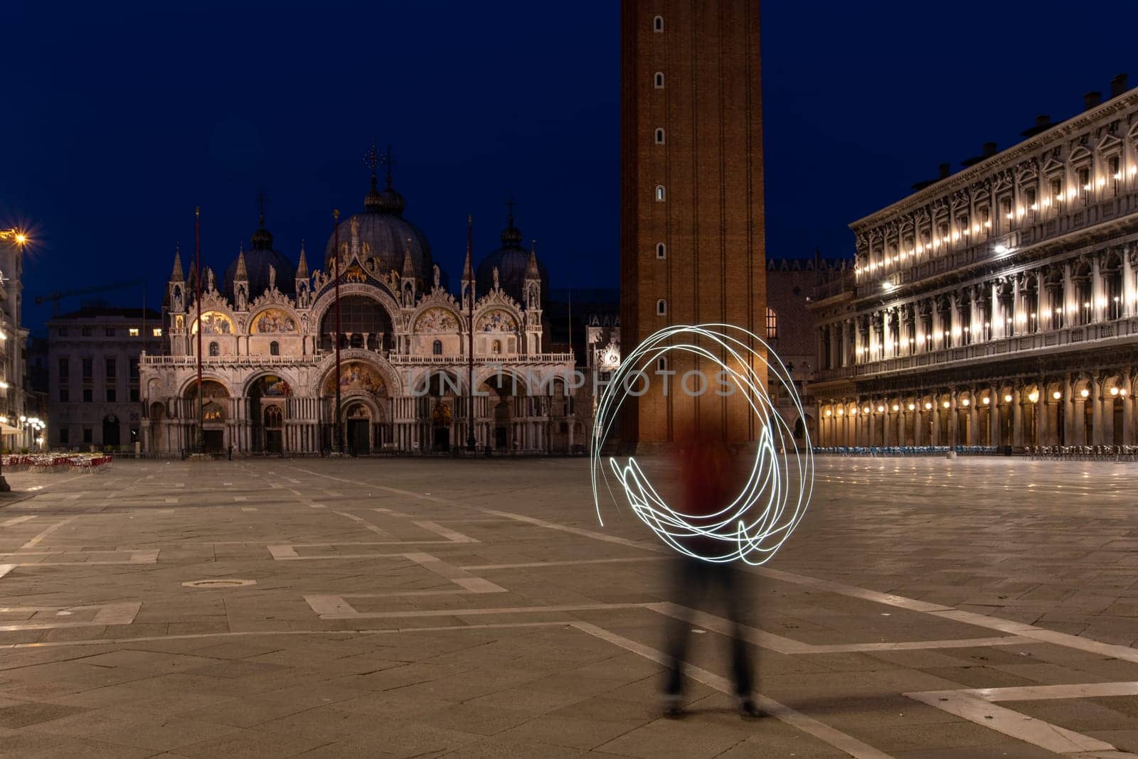 Painting a Circle with Light at the St Mark's Square, Venice, Italy