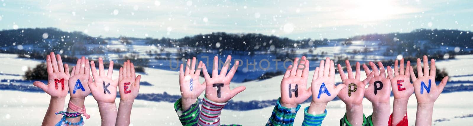 Children Hands Building Colorful English Word Make It Happen. White Winter Background With Snowflakes And Snowy Landscape.