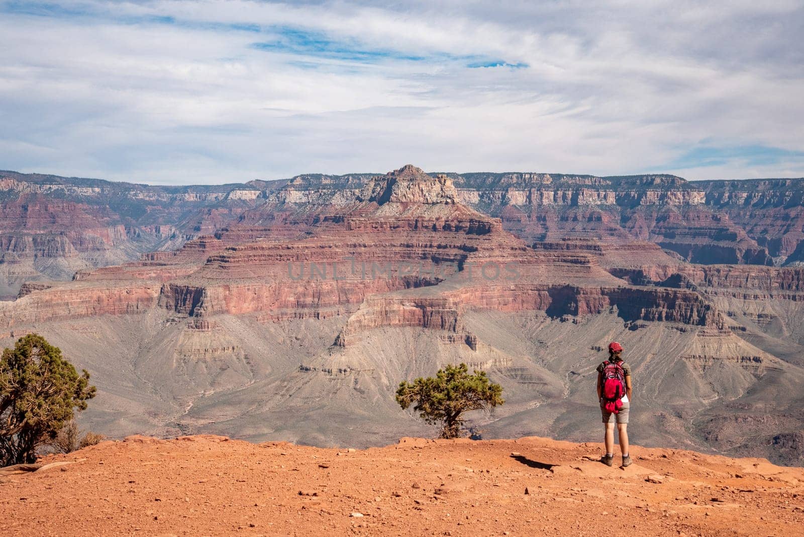 A female hiker enjoying the view from the famous Grand Canyon from South Kaibab trail, USA