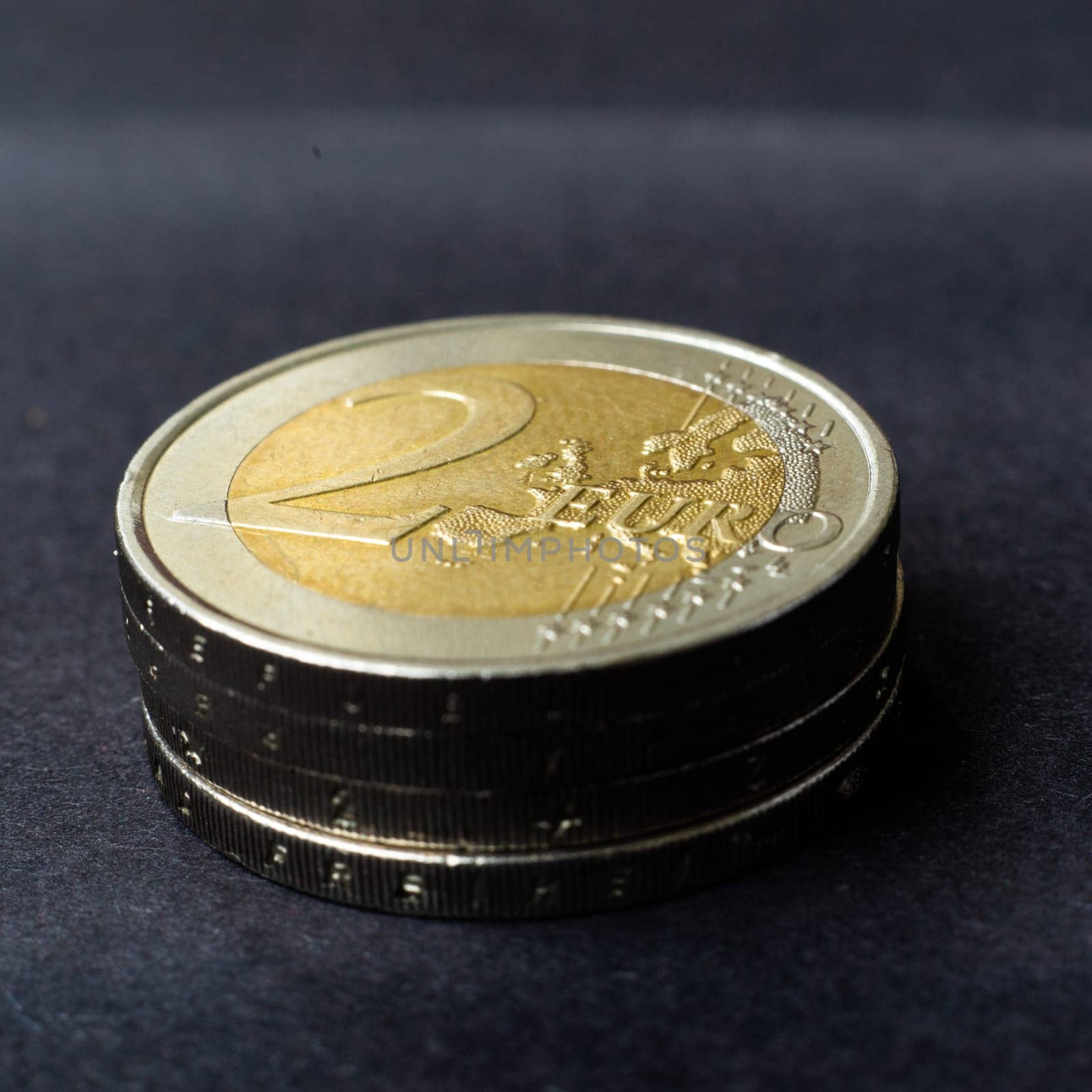 Euro close up photos. Macro coins. Soft focus, dark background