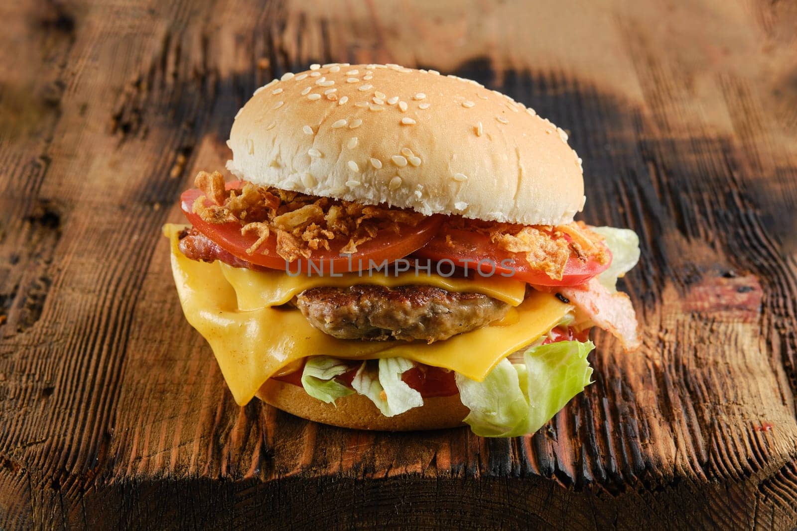 Burger beef demi glace with onion crumbs on wooden background