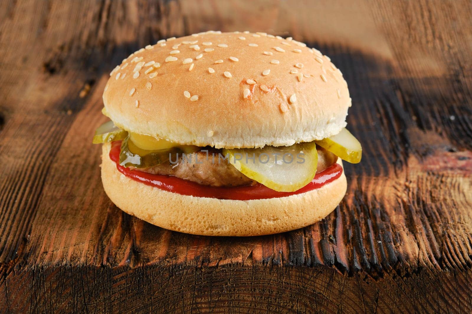 Traditional hamburger on rustic wooden background