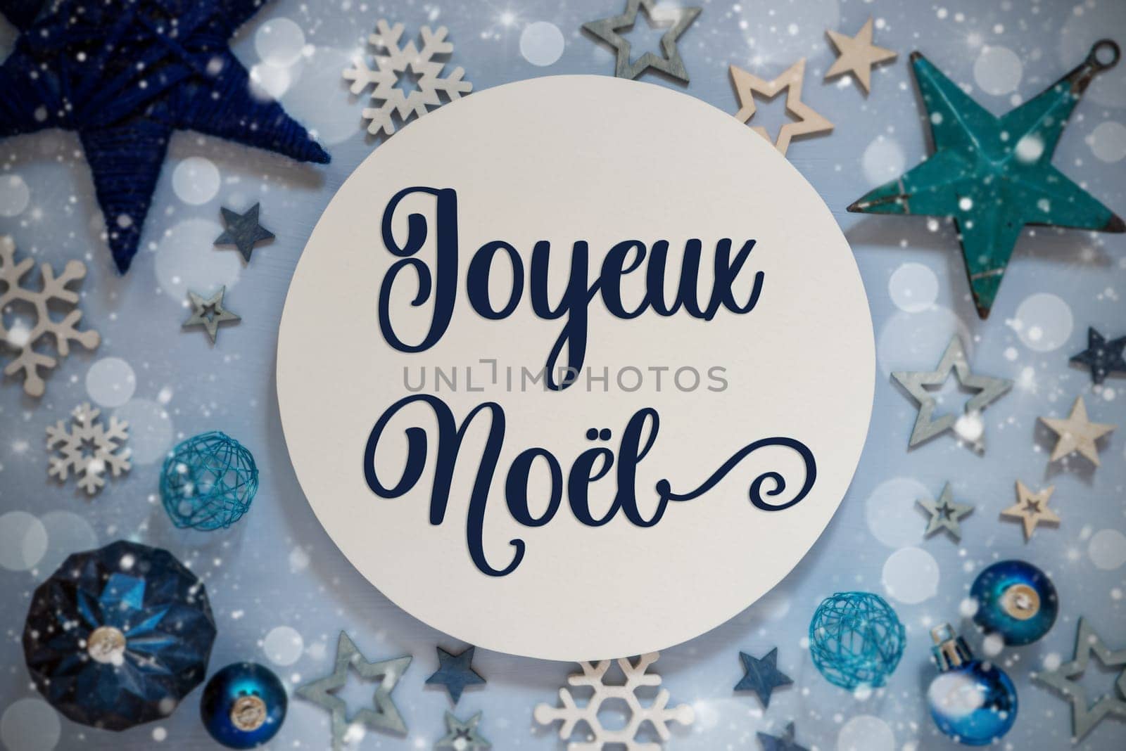 Blue Christmas Decor With Stars, Christmas Balls And Sign With French Text Joyeux Noel, Which Means Merry Christmas In English