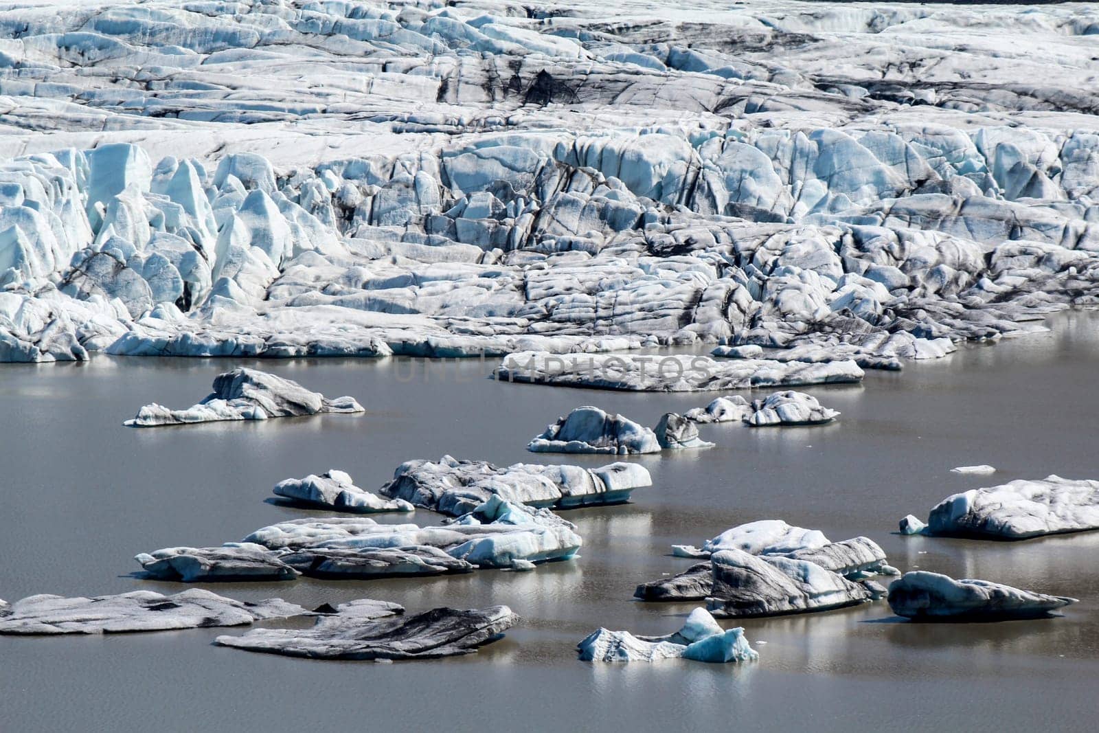 Close-up of Skaftafell glacial tongue, small icebergs in the lake, Iceland