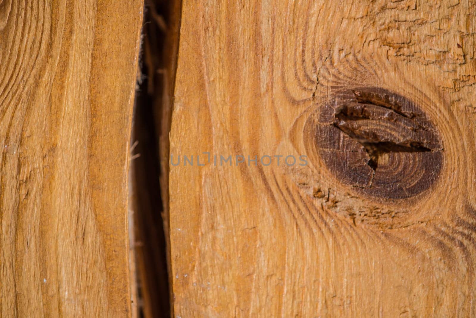 old plank with crack and knothole