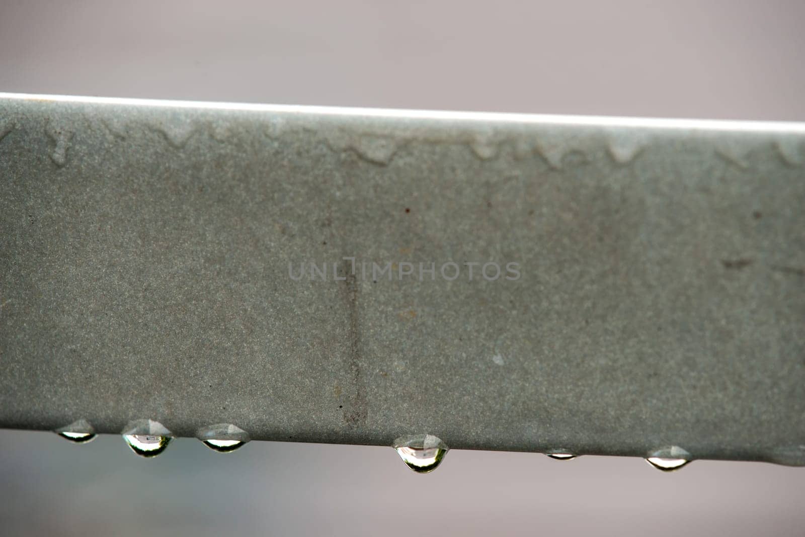 rain drops on a balcony railing