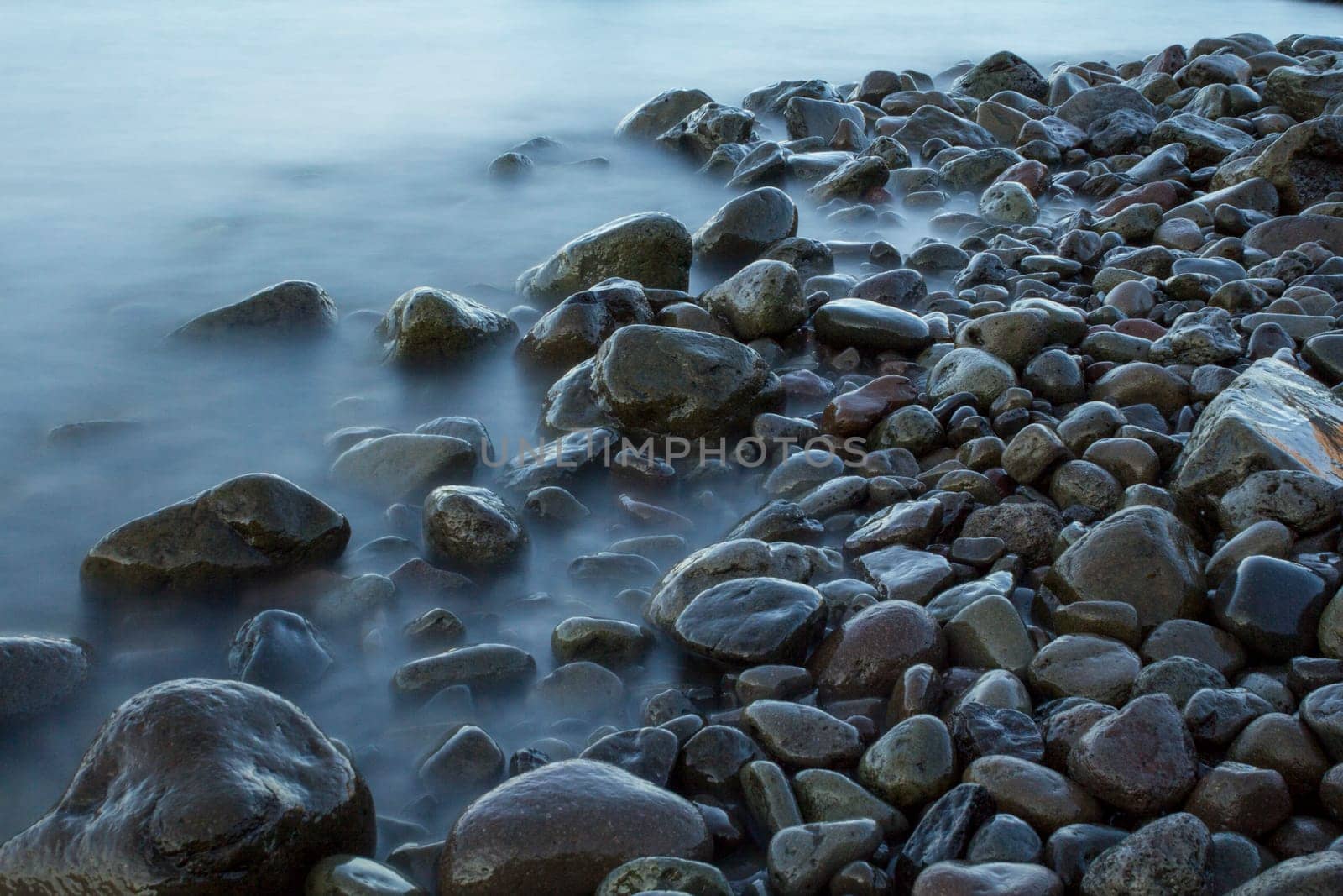 Time exposure of stones in the Westfjords coast, Iceland