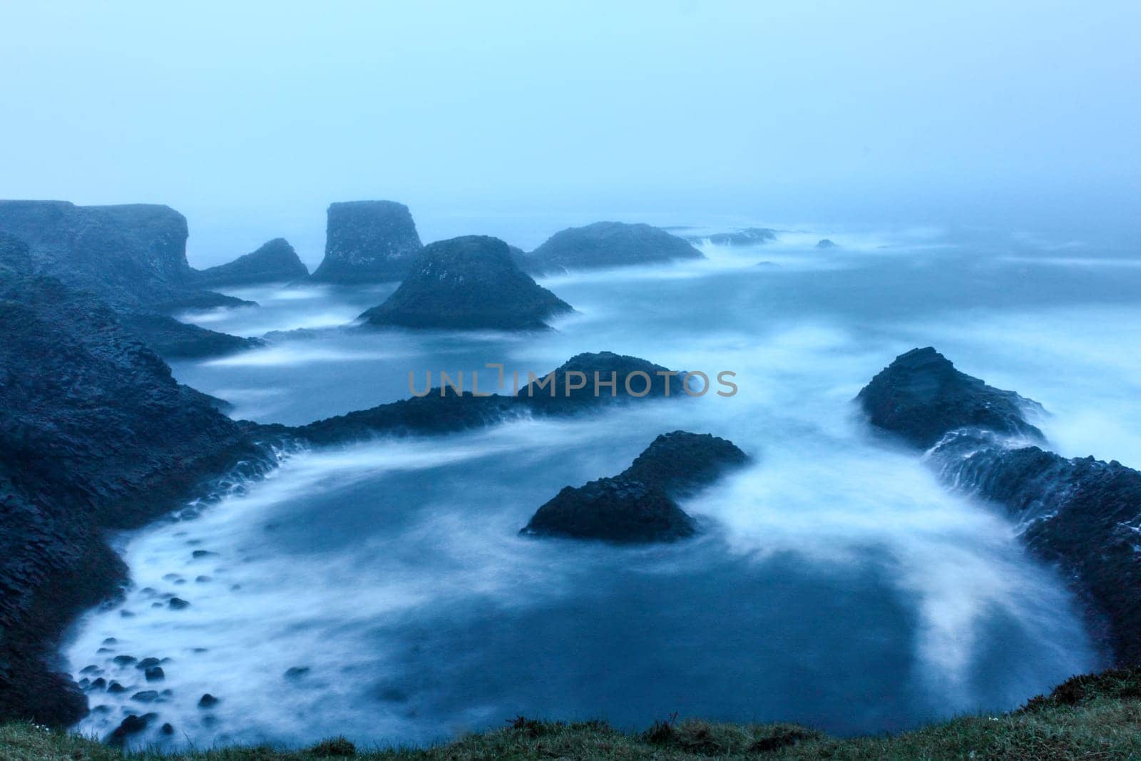 Stormy coastal landscape of Arnarstapi at night, Iceland