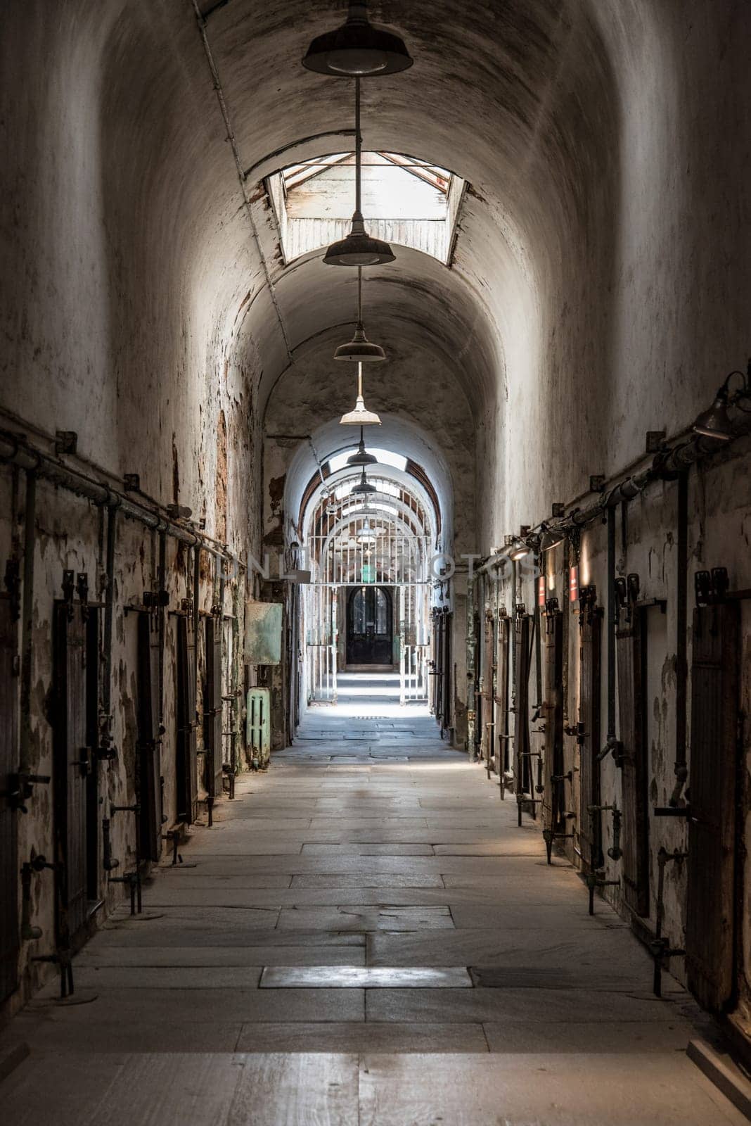 PHILADELPHIA, USA - AUGUST 15, 2022 - Corridor with cells at the old abandoned Eastern State Penitantiary, USA