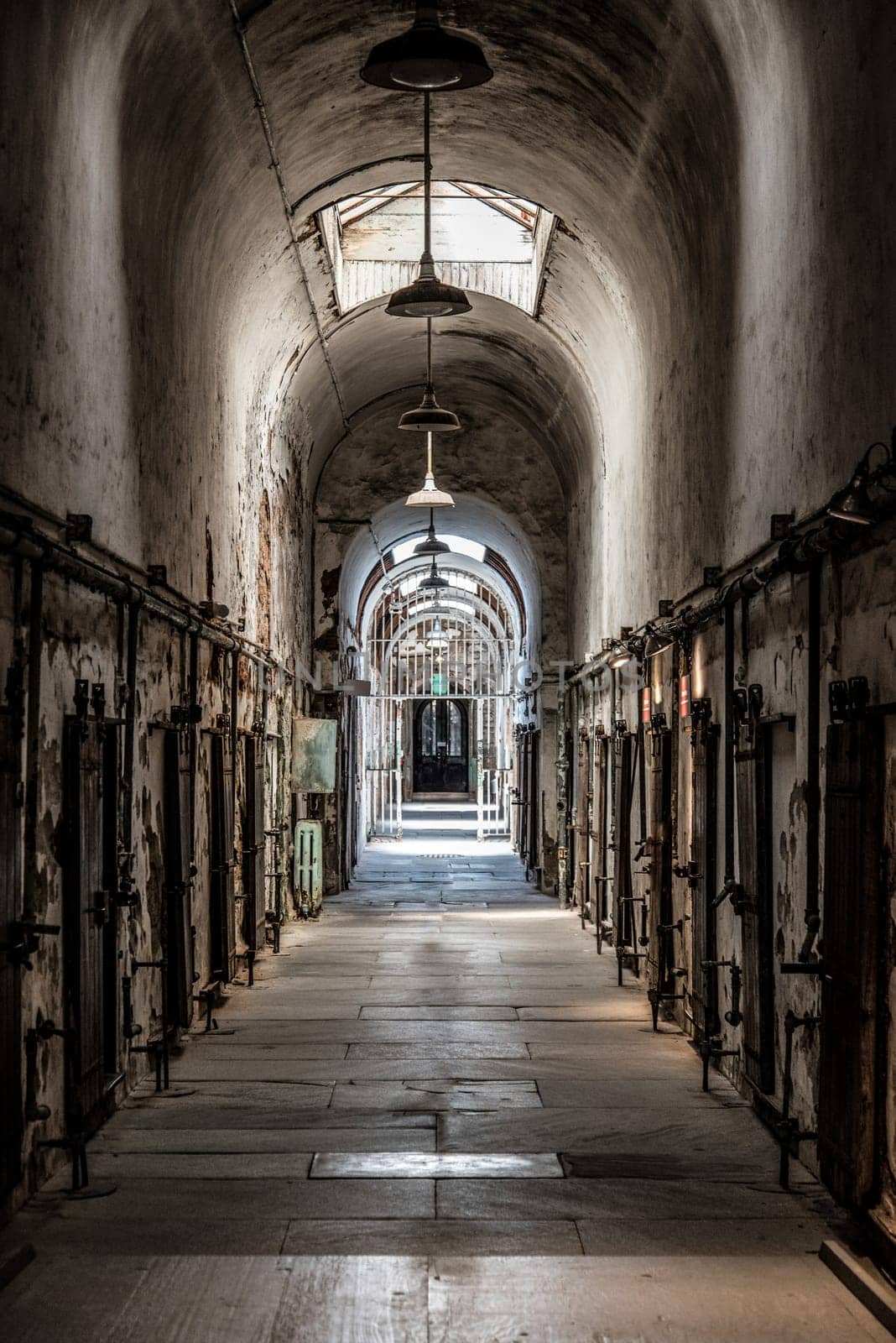 PHILADELPHIA, USA - AUGUST 15, 2022 - Corridor with cells at the old abandoned Eastern State Penitantiary, USA