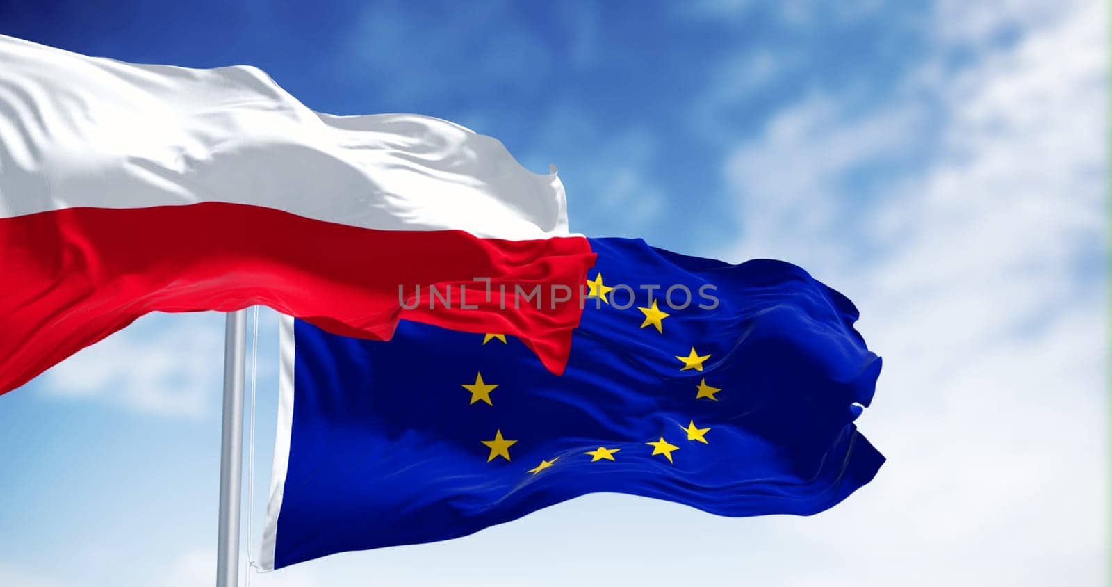Flags of Poland and European Union waving together on a clear day. Poland has been a member of the EU since May 1, 2004. 3d illustration render. Fluttering fabric