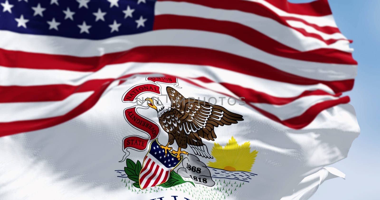 The Illinois state flag waving with the national flag of the United States of America on a clear day. 3D illustration render. Fluttering fabric. Selective focus