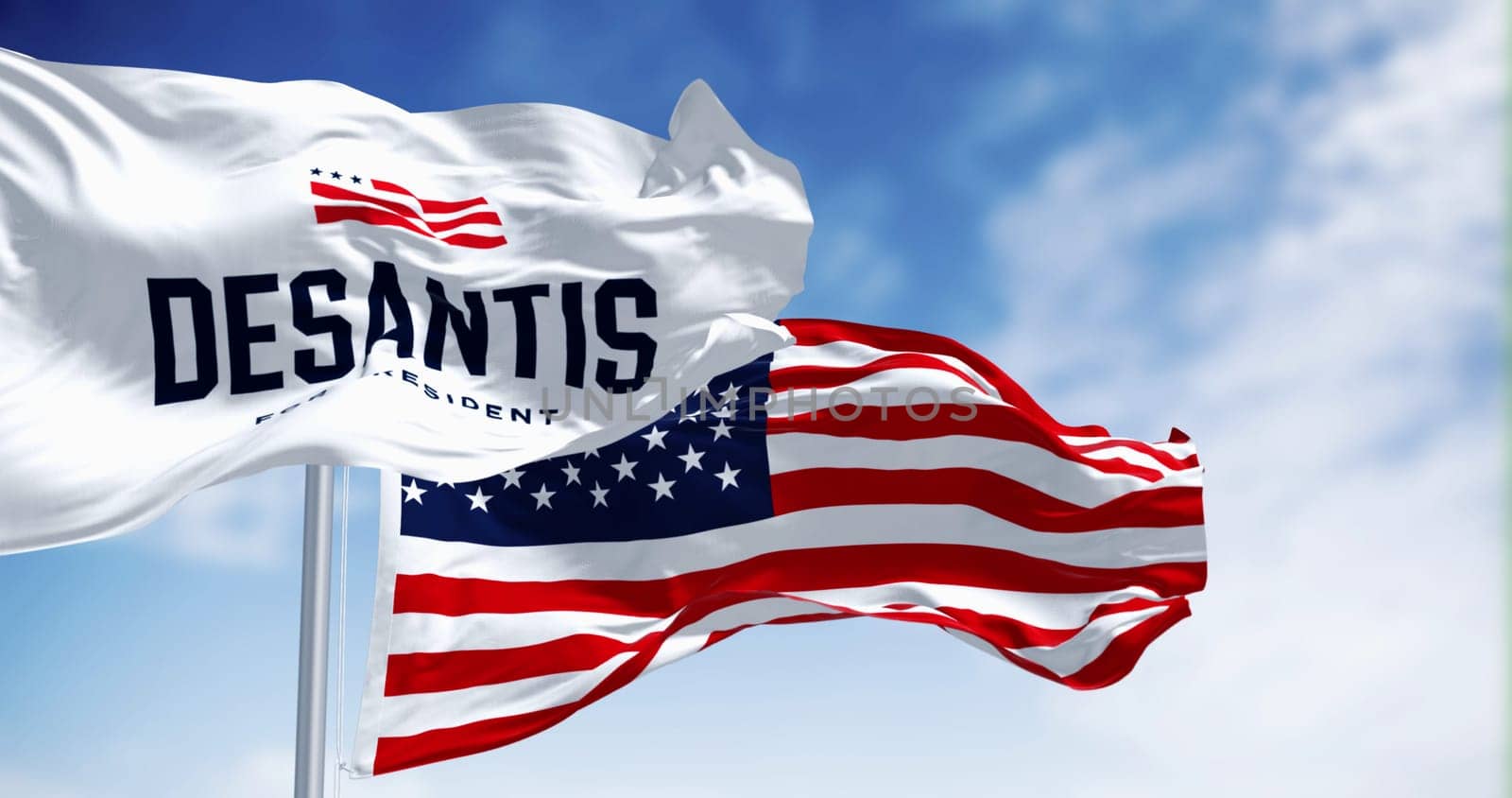 Tallahassee, US, April 30 2023: Ron DeSantis 2024 Republican presidential primaries campaign flag waving with national US flag. Illustrative editorial 3d illustration render. Republican primaries