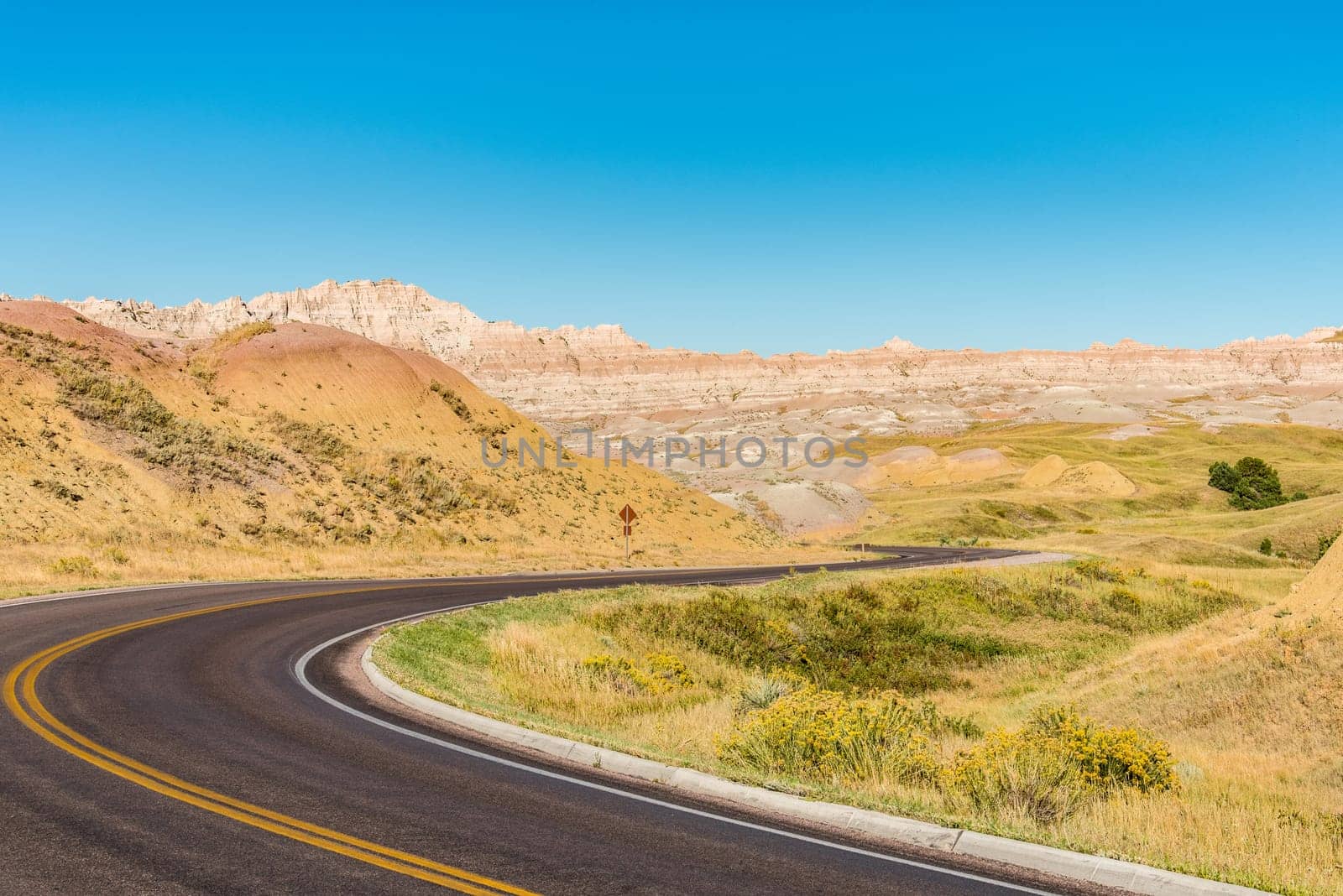 Fascinating colorful hills along the road leading through Badlands National Park, USA