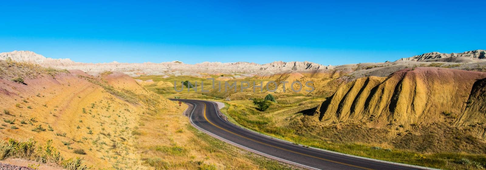 Fascinating colorful hills along the road leading through Badlands National Park, USA