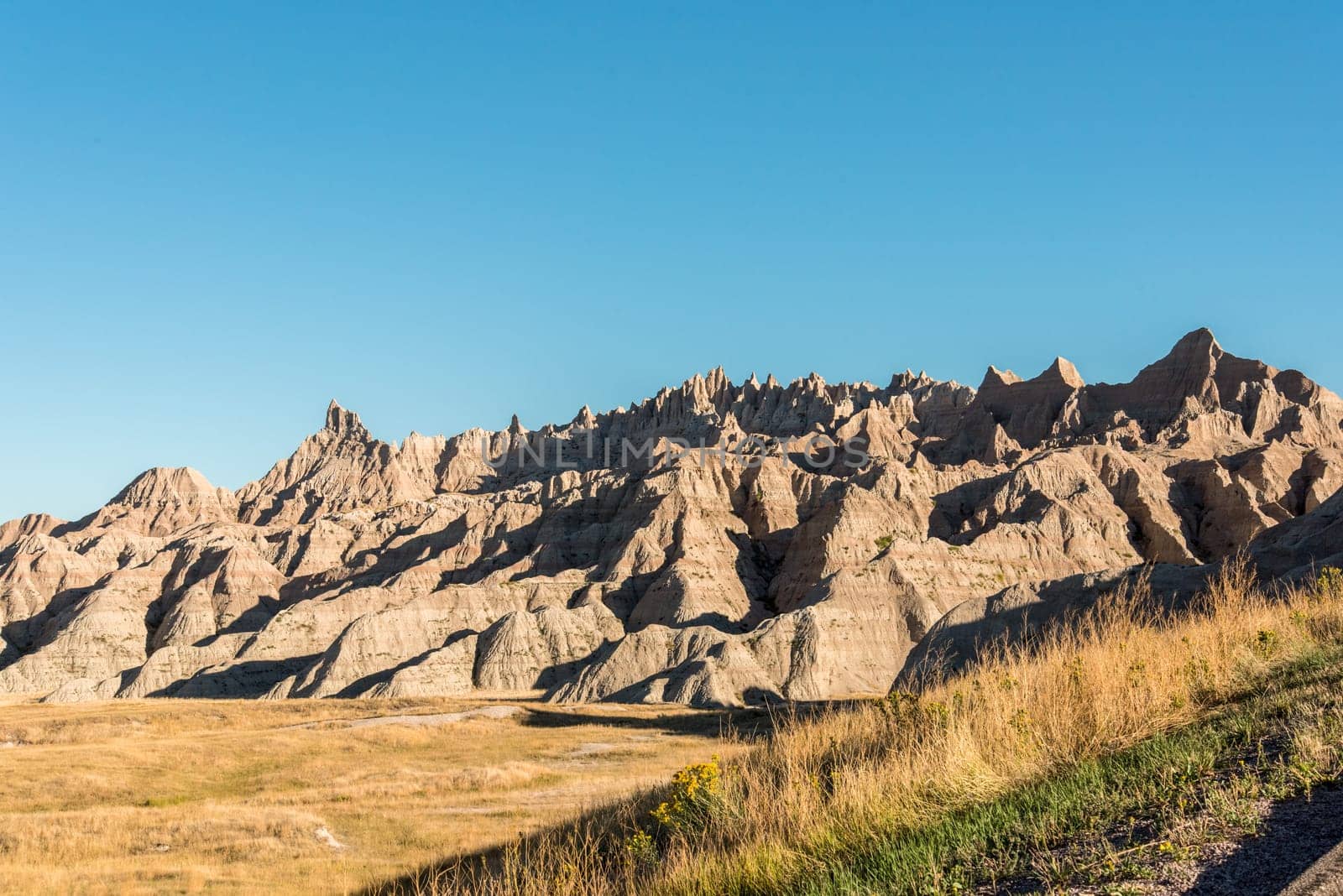 Wide landscape and sandstone hills in the Badlands National Park, USA