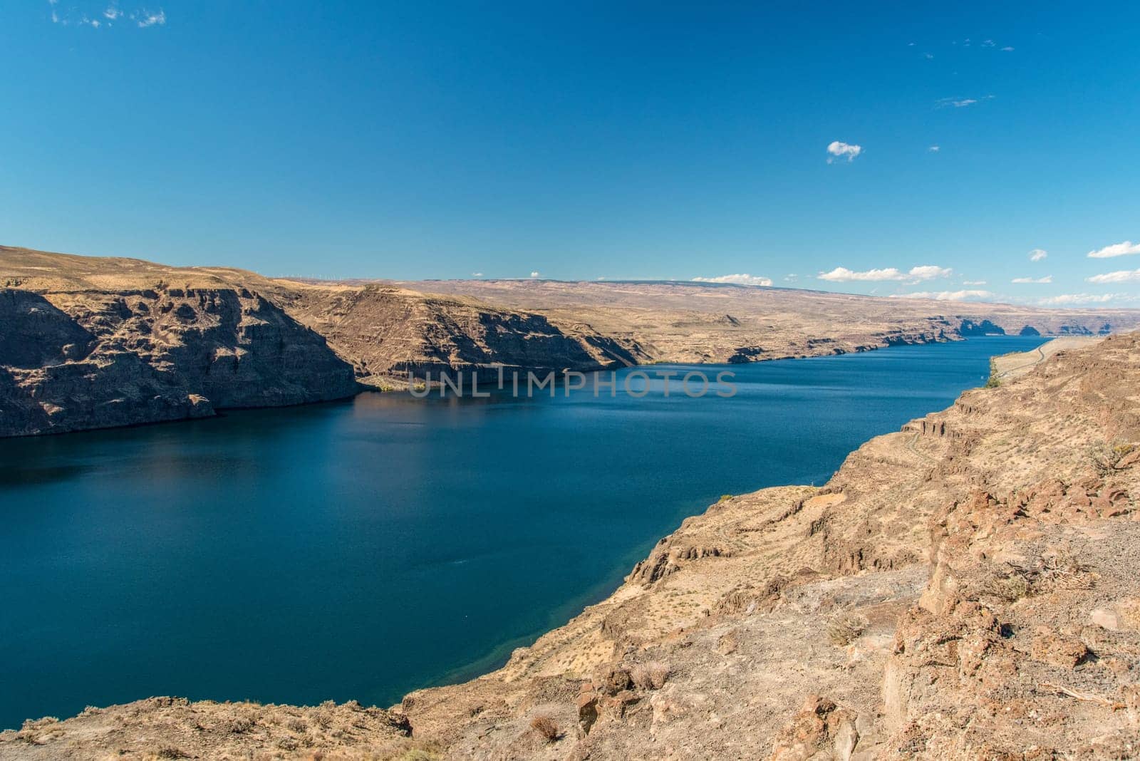The huge Columbia river in Washington state, dry landscape surrounding the water, USA