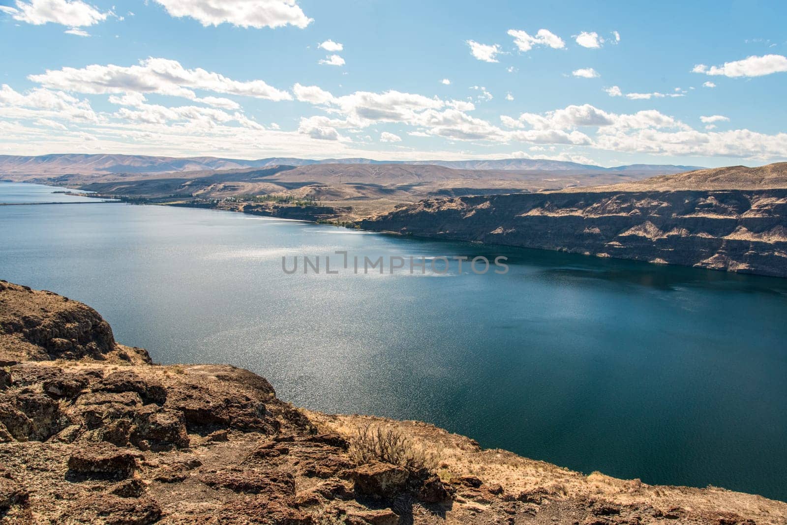 The huge Columbia river in Washington state, dry landscape surrounding the water, USA