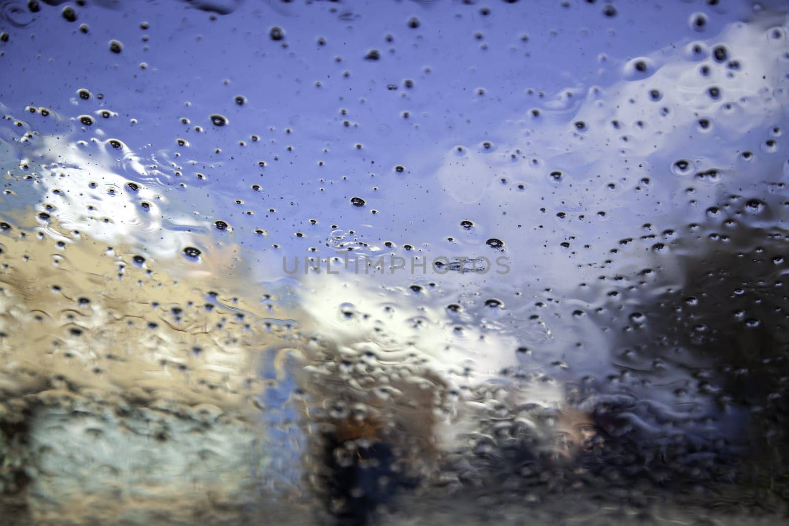 Detail of car glass wet from the rain, cold in winter