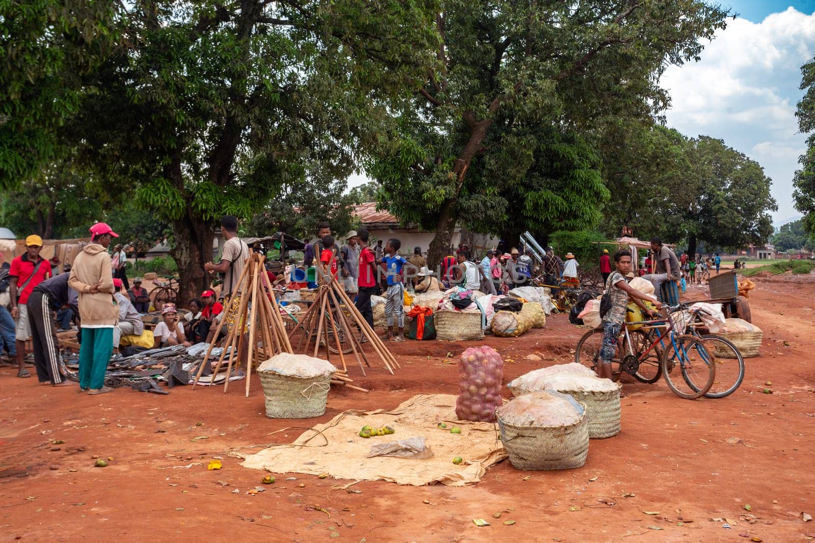 Mandoto, Madagascar - November 9th, 2022: Street market in Mandoto city, with vendors and ordinary people shopping and socializing. In this place you can buy and sell practically everything.