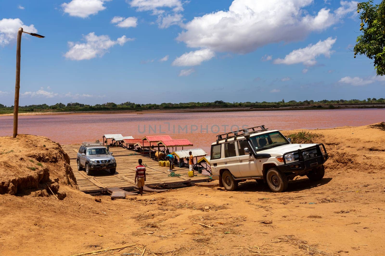 Port Bac Belo Sur Tsiribihina, Madagascar - November 4th, 2022: A ferry carrying passengers and cars travels on the port Tsiribihina on River Mania in Madagascar.