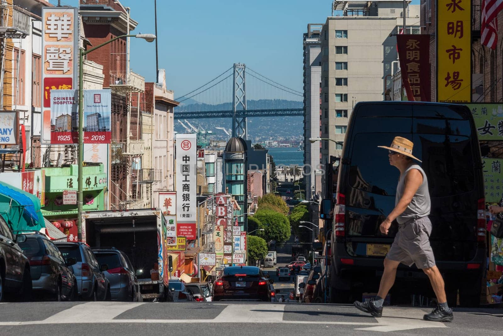 SAN FRANCISCO, USA - SEPTEMBER 05, 2022 - A person crossing a street in Chinatown in San Francisco, USA