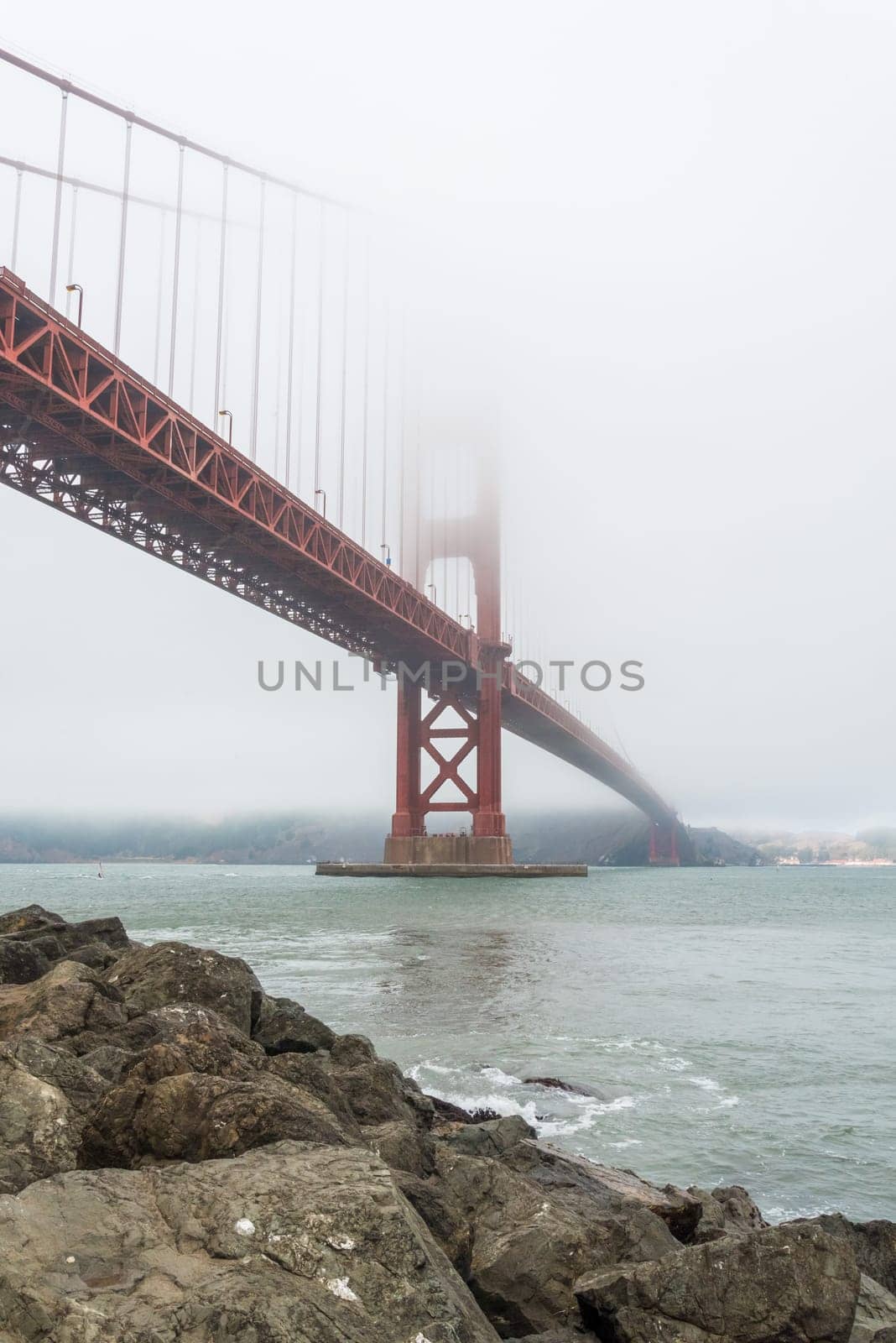 Scenic Golden Gate Bridge in the fog from Fort Poin, San Francisco, USA