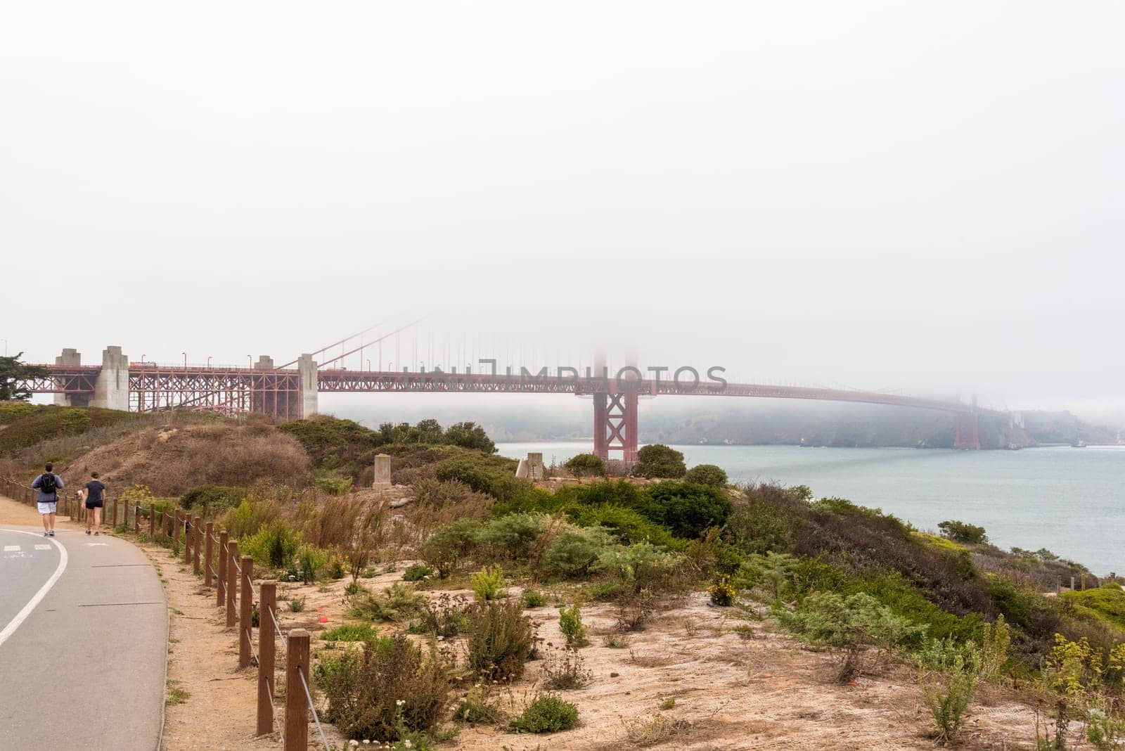 Scenic Golden Gate Bridge in the fog from Fort Poin, San Francisco, USA