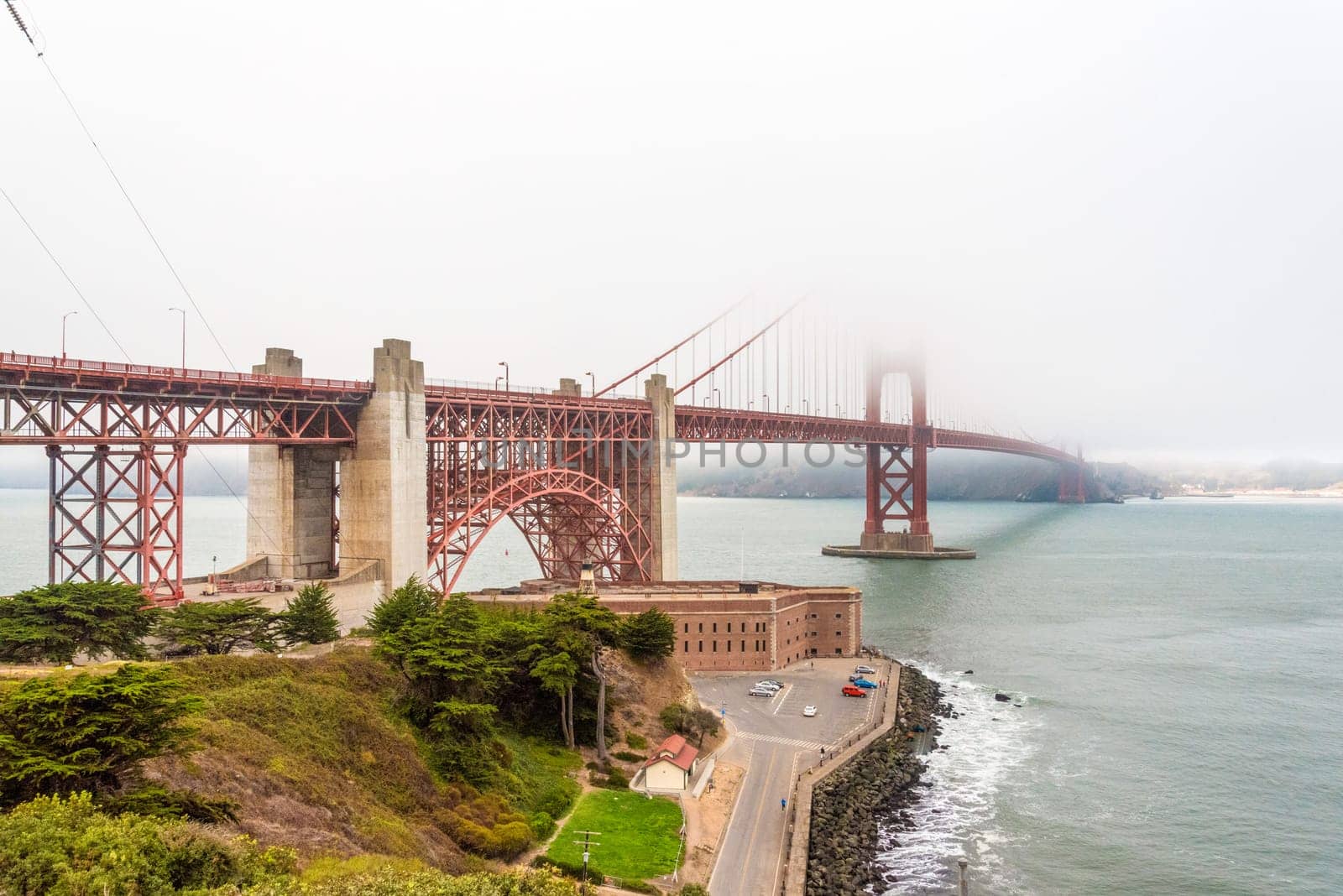 Scenic Golden Gate Bridge in the fog from Fort Poin, San Francisco, USA