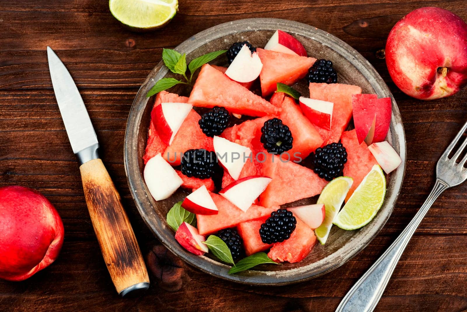 Salad of watermelon, blackberry and peach. Summer fruit diet salad. Detox food