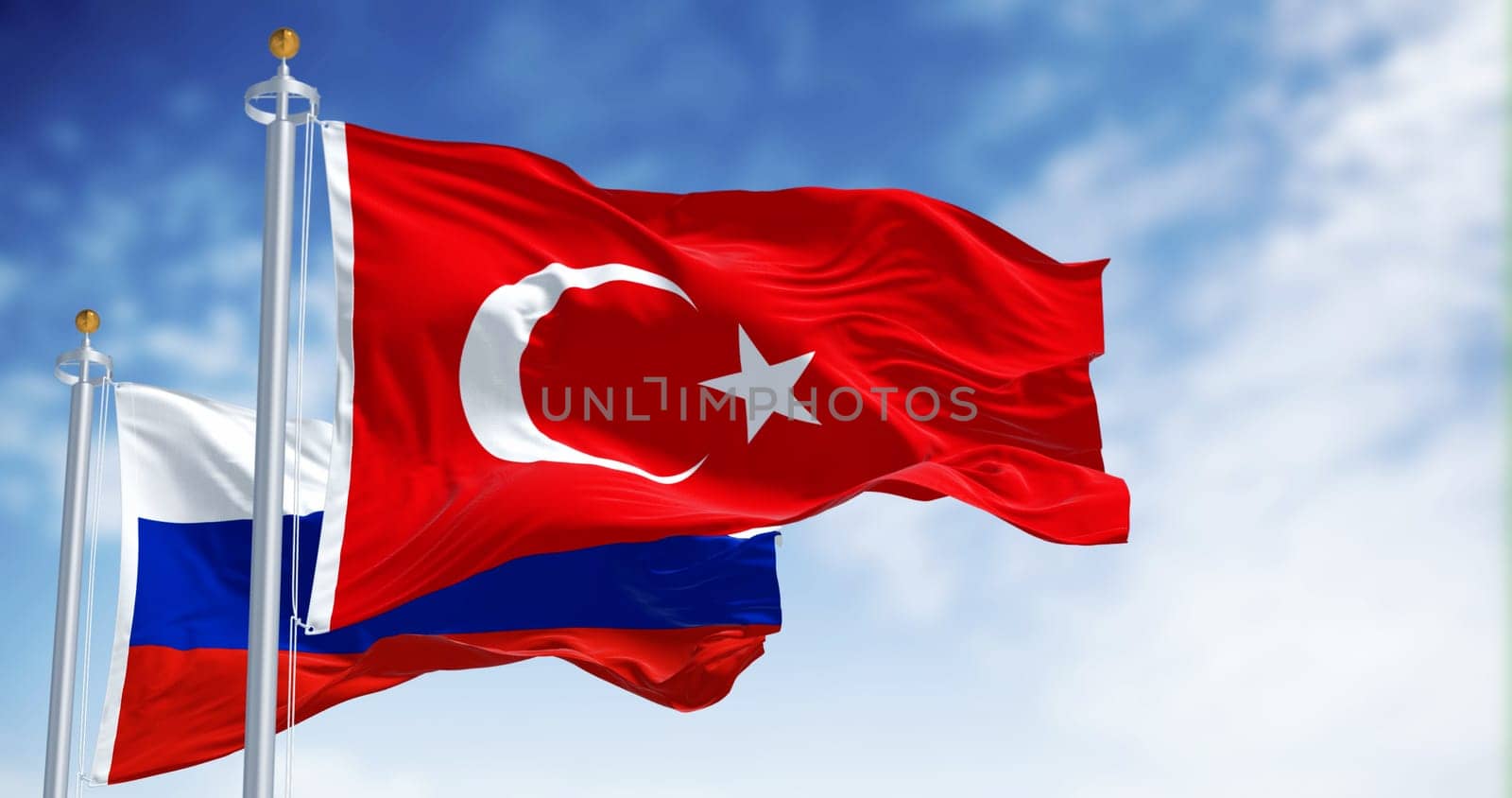 Turkish and Russian national flags waving in the wind on a clear day. 3d illustration render. Fluttering fabric. International relations