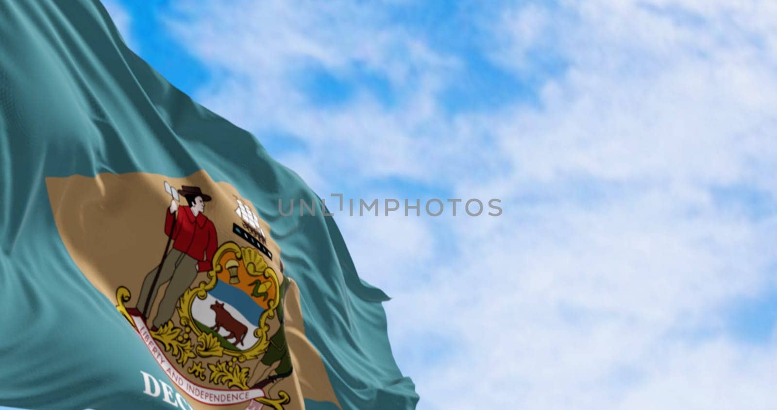 Delaware state flag waving on a clear day. Colonial blue background with a buff-colored diamond and state coat of arms, and December 7, 1787 below it. 3d illustration render. Fluttering fabric